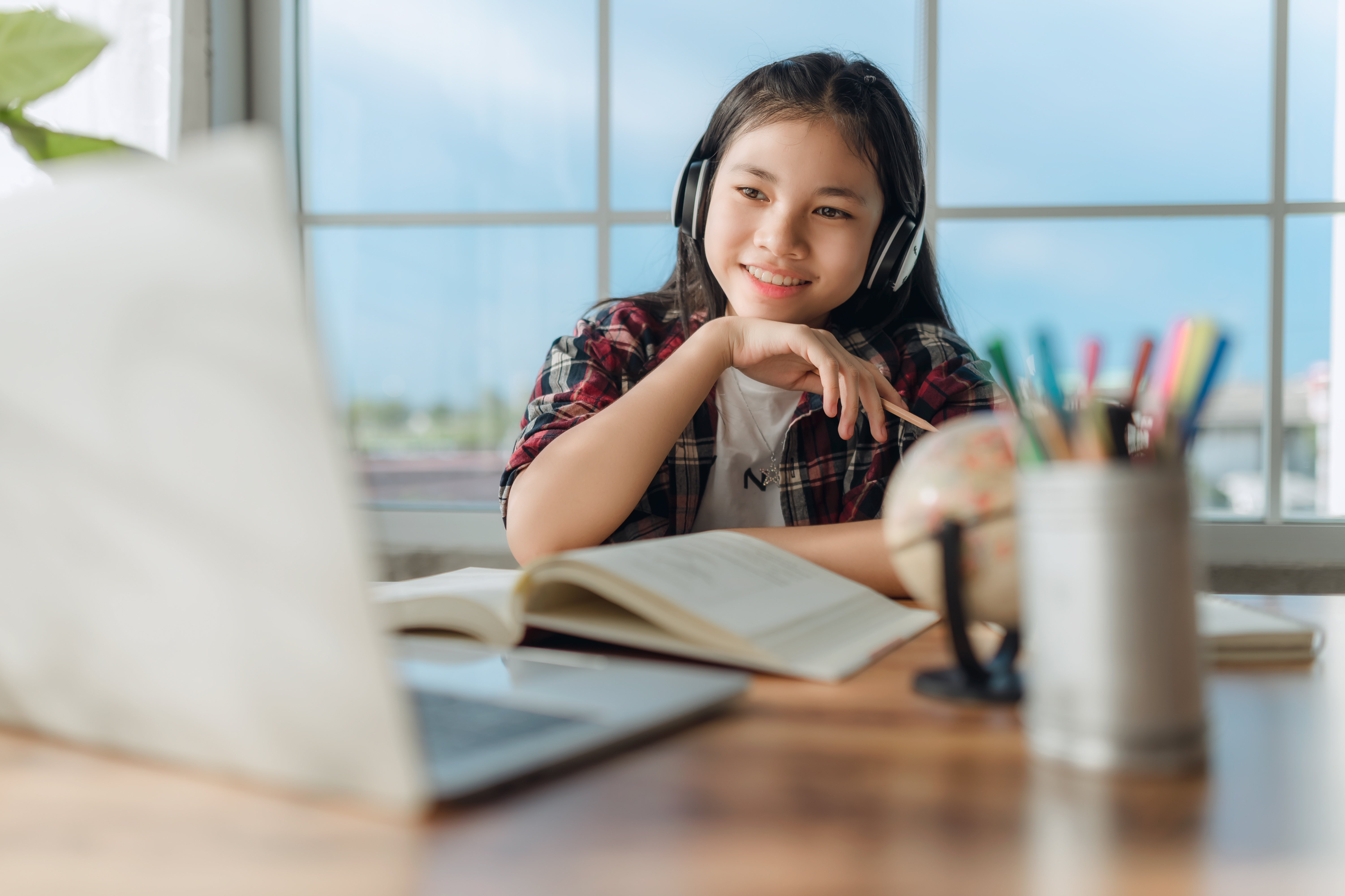asian-teen-girl-student-wear-wireless-headphone-study-online-with-zoom-meeting-happy-young-woman-learn-language-listen-lecture-watch-webinar-write-notes-look-laptop-distant-education